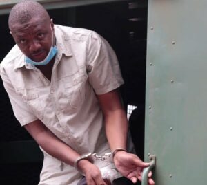 Hopewell Chin’ono in handcuffs. Image: Supplied